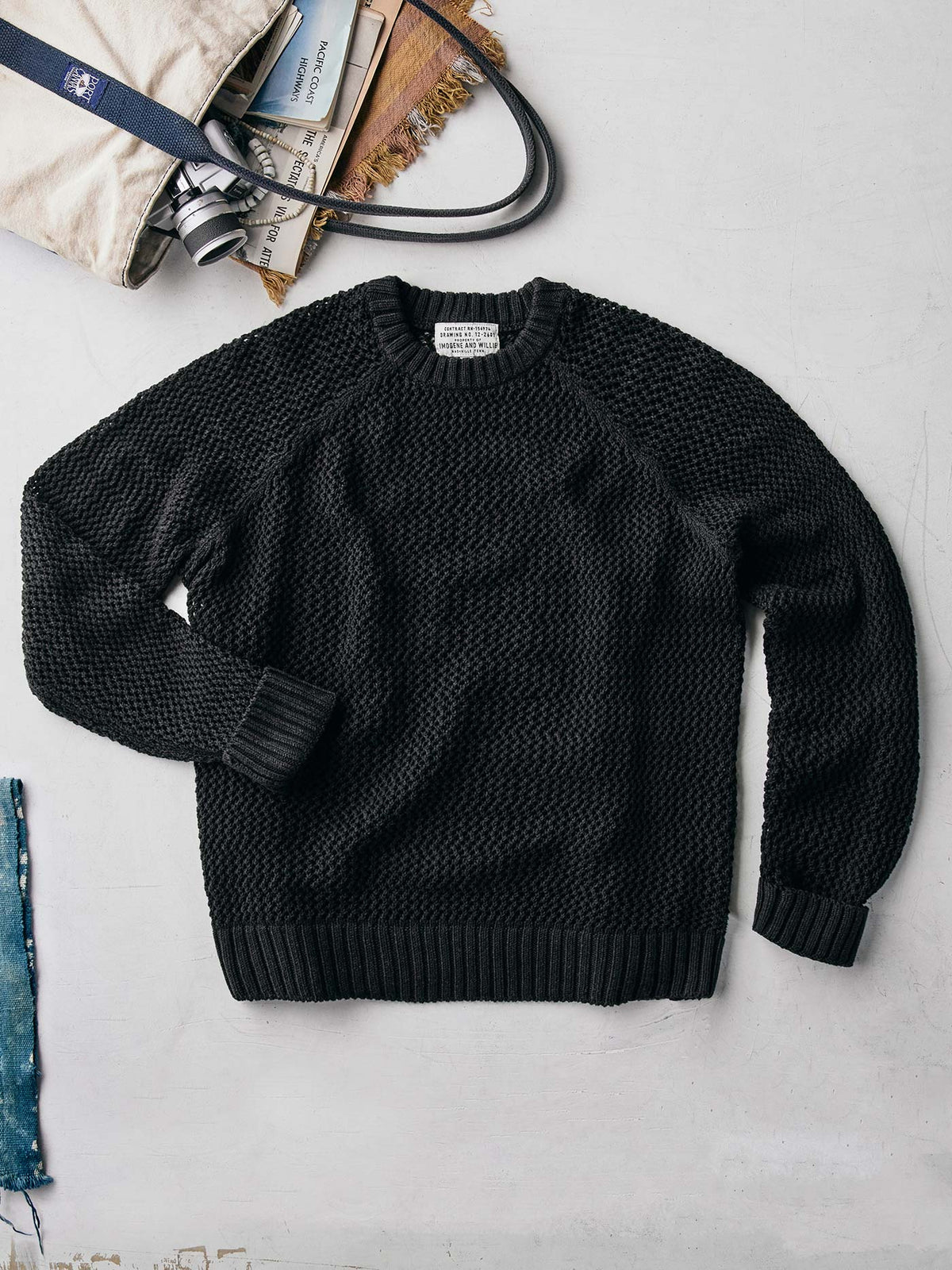cascabel open weave sweater in black
