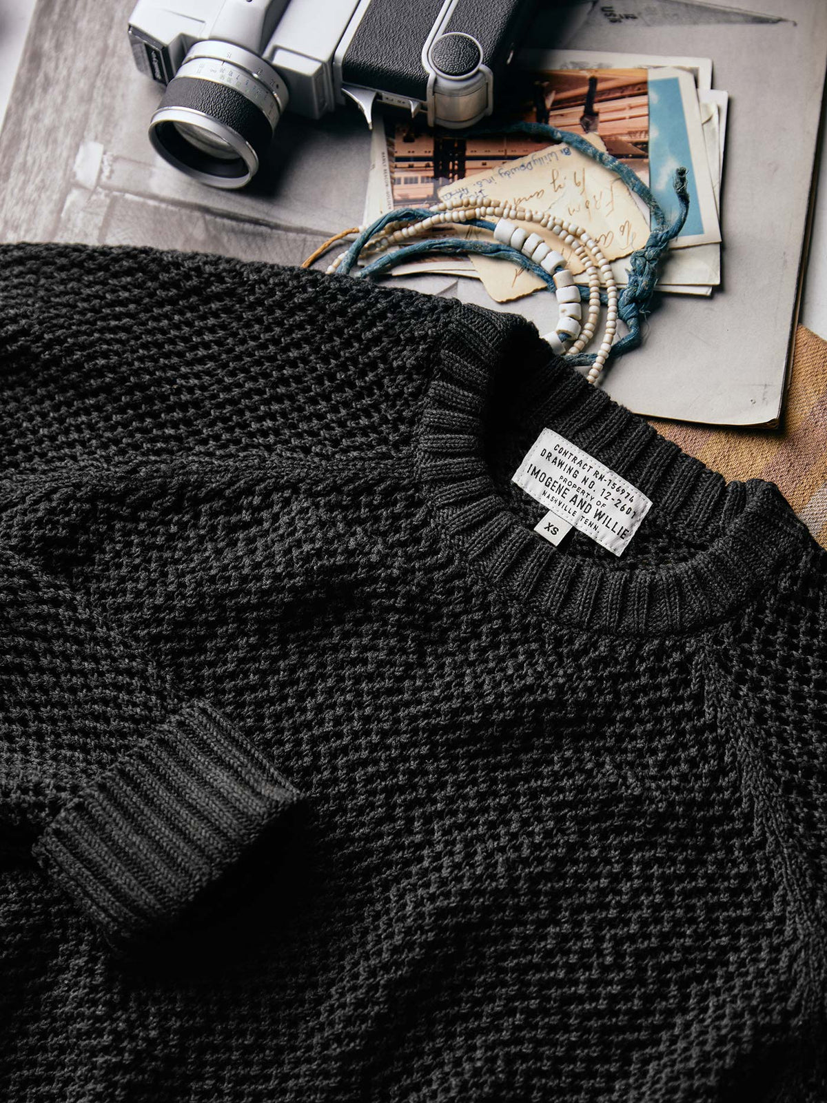 cascabel open weave sweater in black