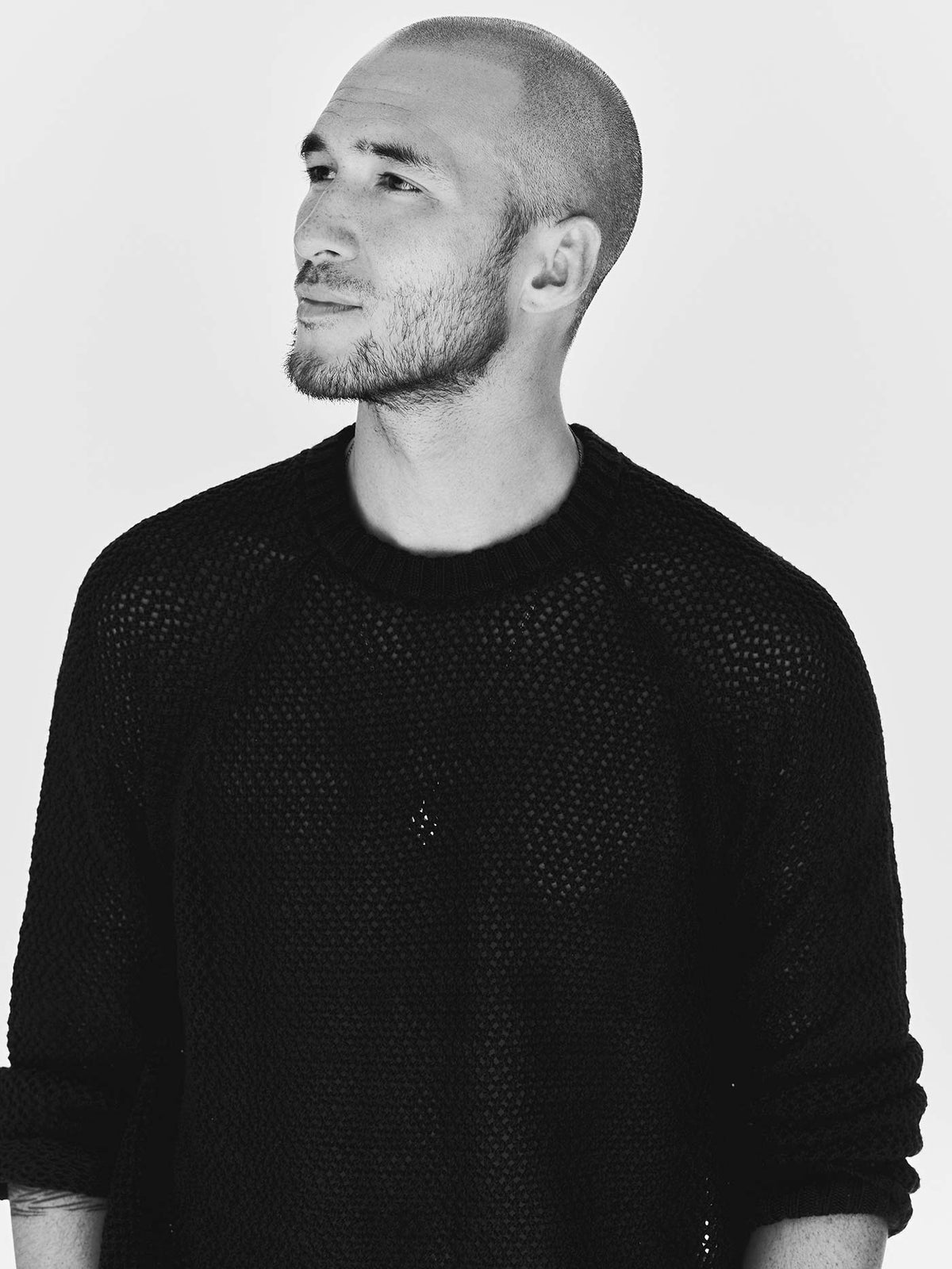 cascabel open weave sweater in black