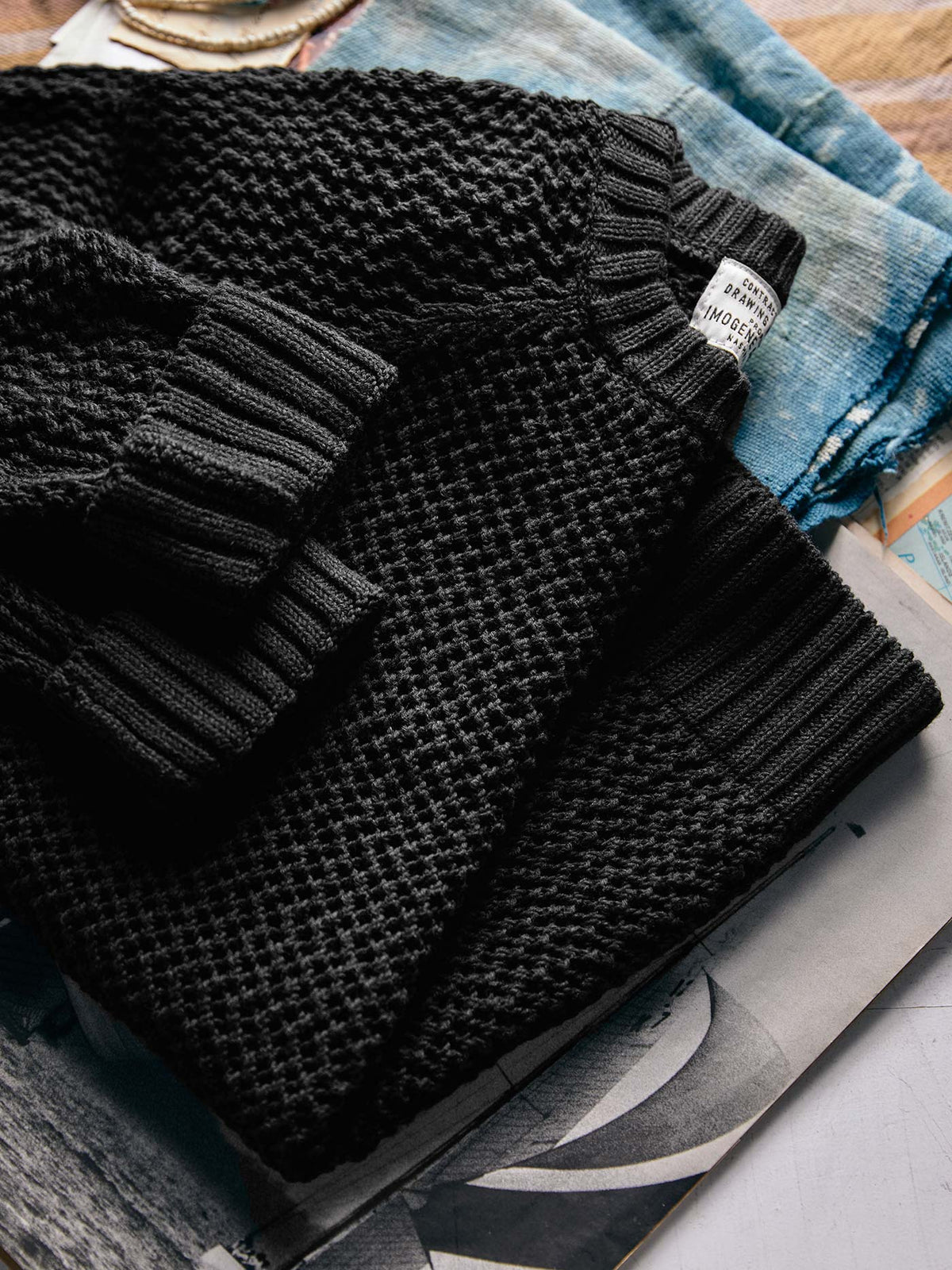 cascabel open weave sweater in black