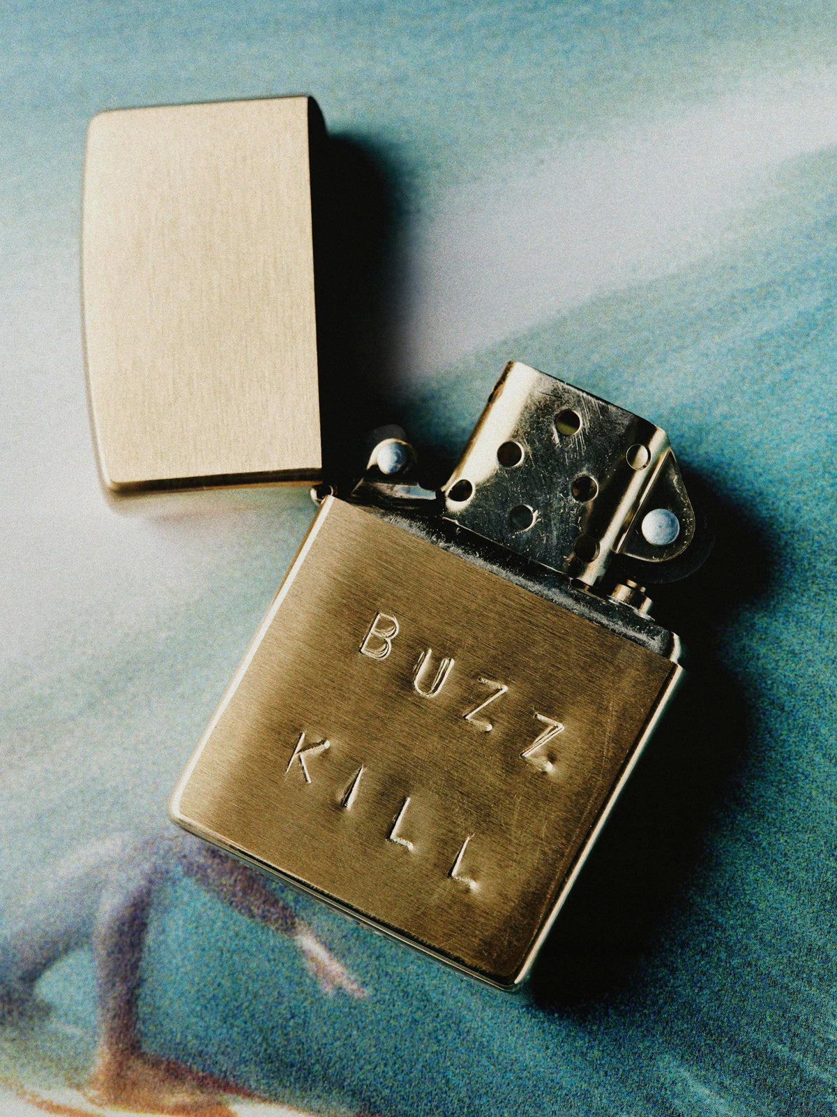 hand stamped “buzz kill” zippo