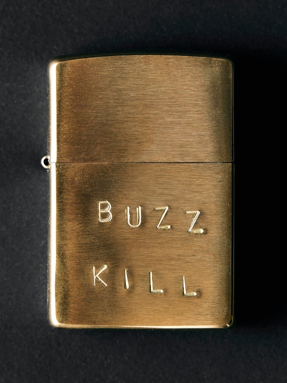 hand stamped “buzz kill” zippo