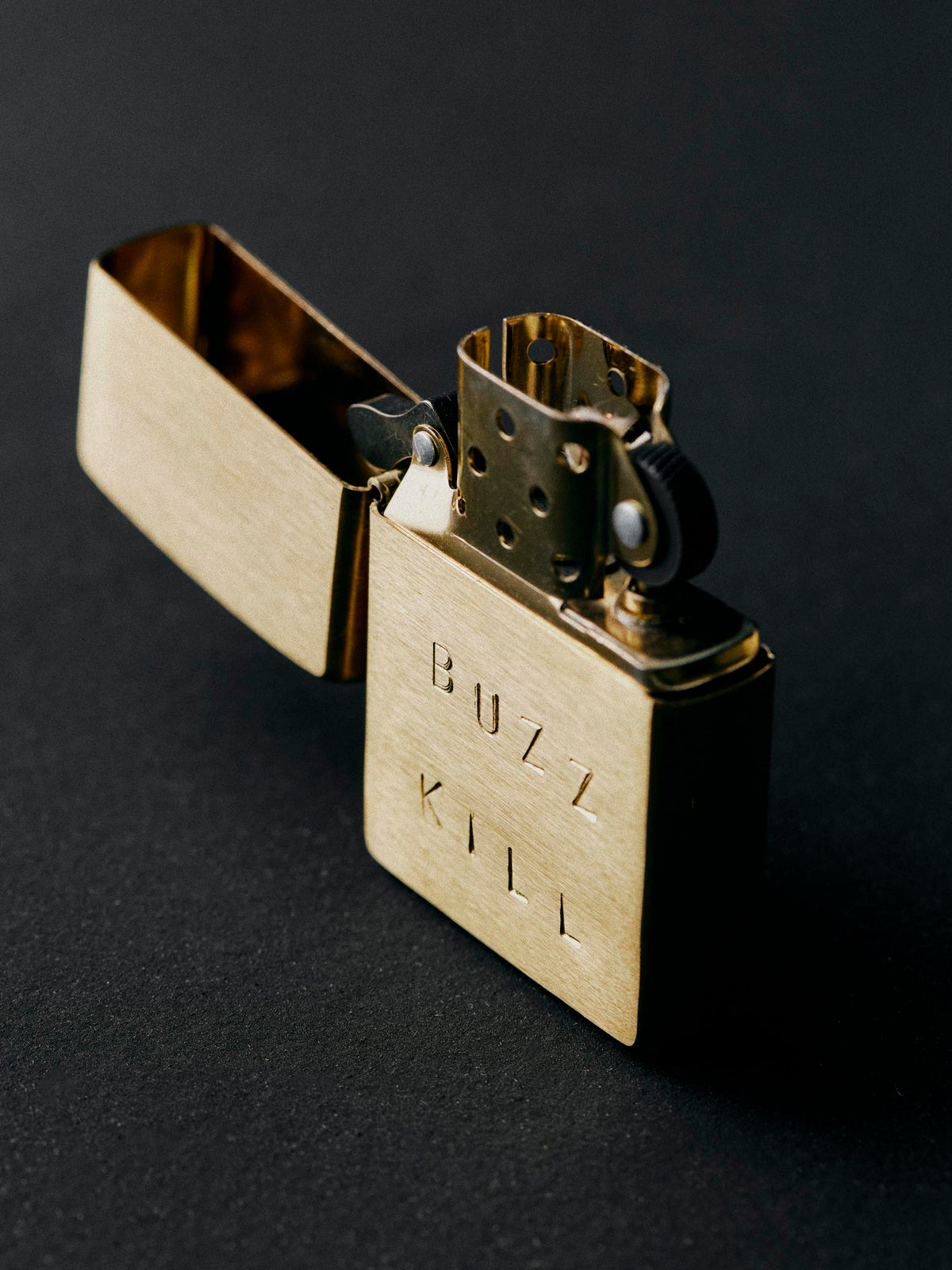 hand stamped “buzz kill” zippo