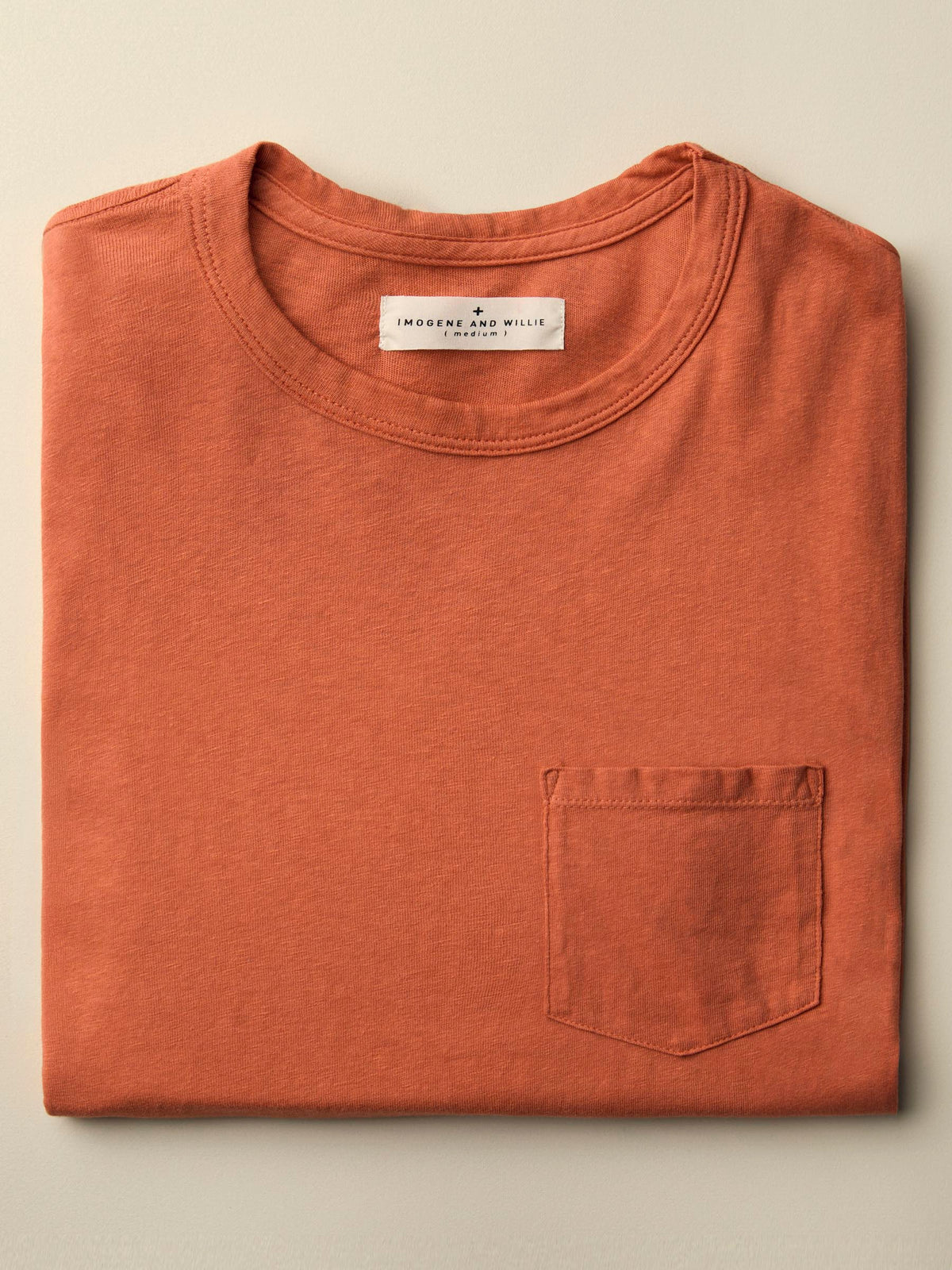faded orange knit pocket tee