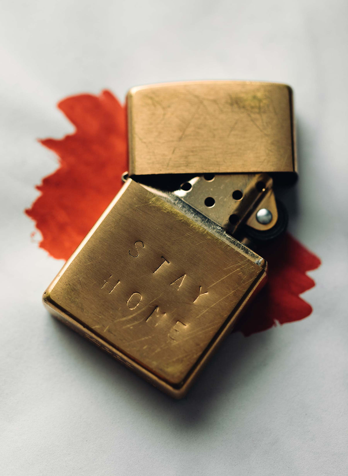 hand stamped “stay home” zippo